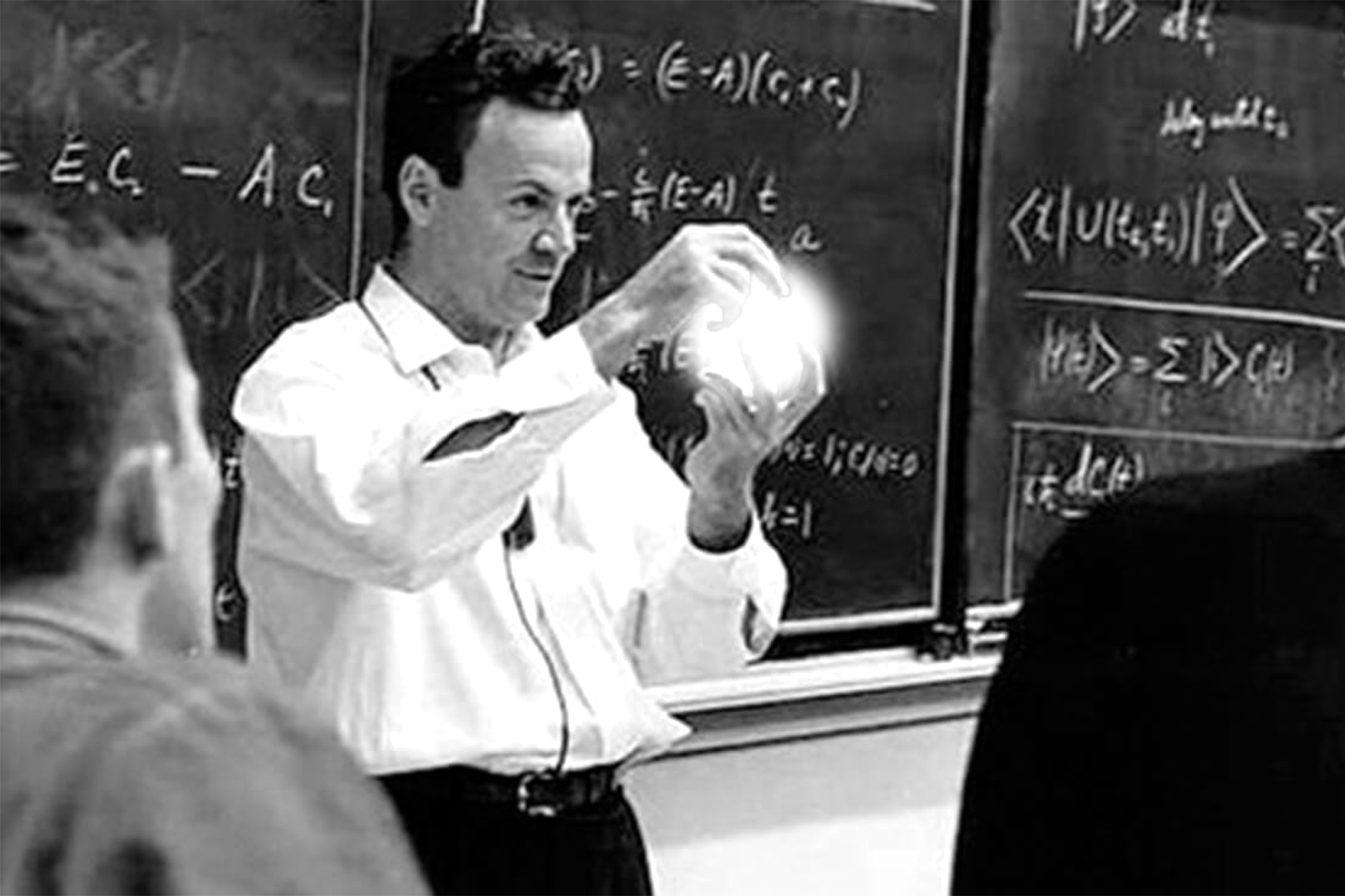 Richard Feynman with a magic ball in front of a class teaching