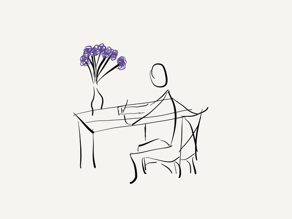 Line drawing of person writing at desk with a vase of purple flowers on the table