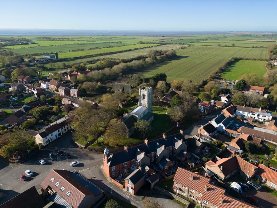 Easington and its church held within the surrounding landscape