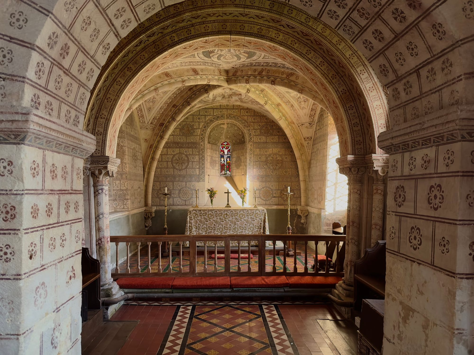 Decorated Romanesque interior at St George, Hampnett