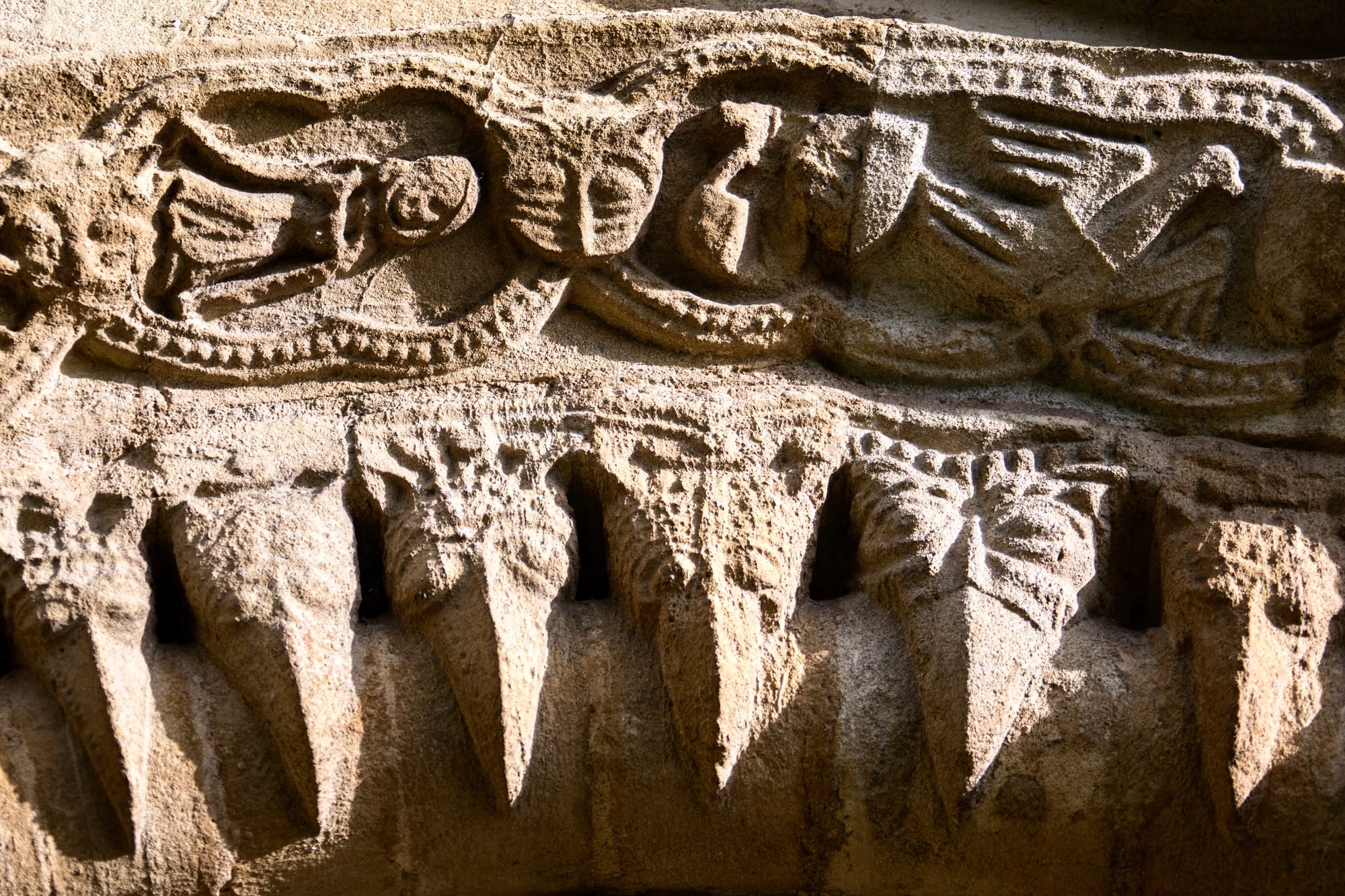 Row of Romanesque beakheads at St Mary, Iffley