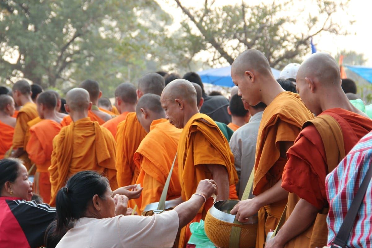 Monks collecting alms