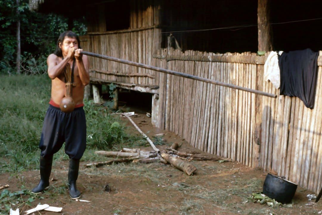 Achuar with a blowpipe in the Ecuadorian Amazon.