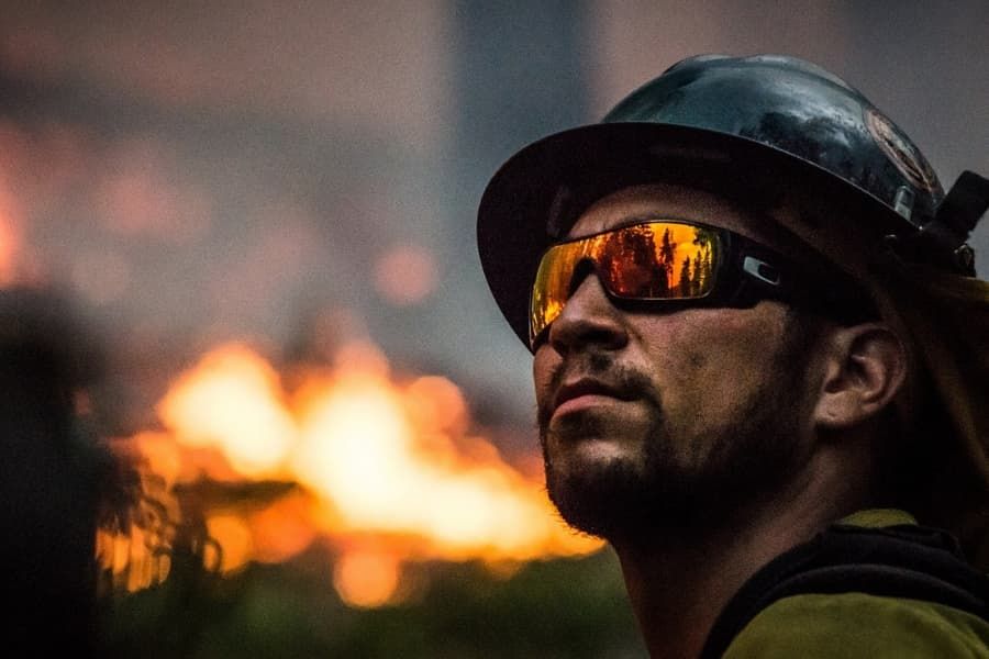 Firefighter against burning trees