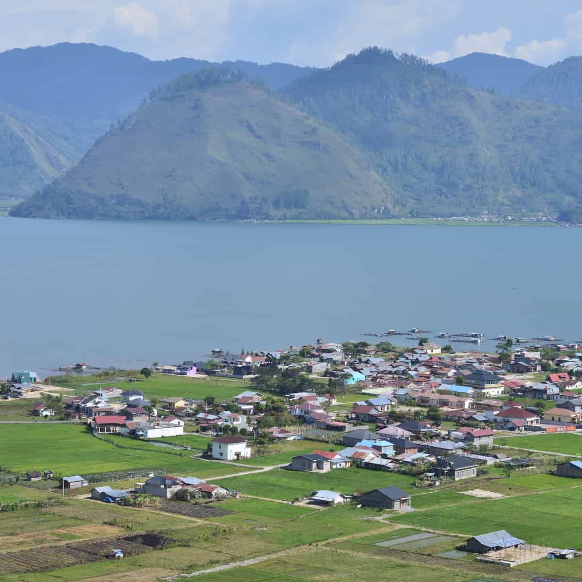 Aerial view of Takengon, a town in the Gayo Highlands of Aceh, Indonesia, situated on the shores of Lake Tawar. The image sho