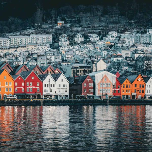 Vibrant view of Bryggen houses in Bergen along the water, showcasing Norwegian architecture.