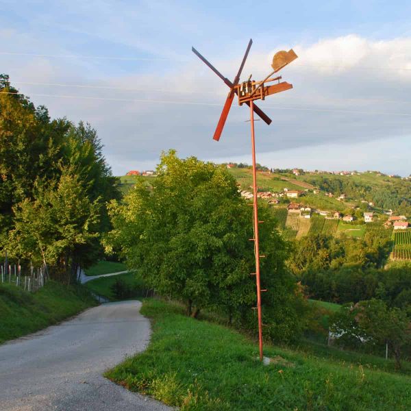 Something that looks like a cross between a windmill and a weathervane on a thin pole.