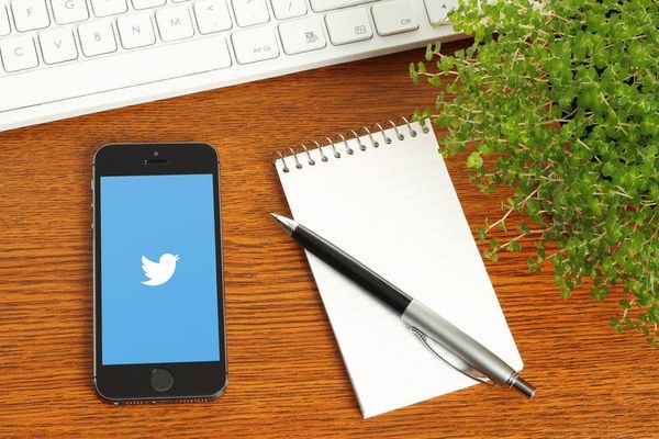 iPhone with Twitter on a desk