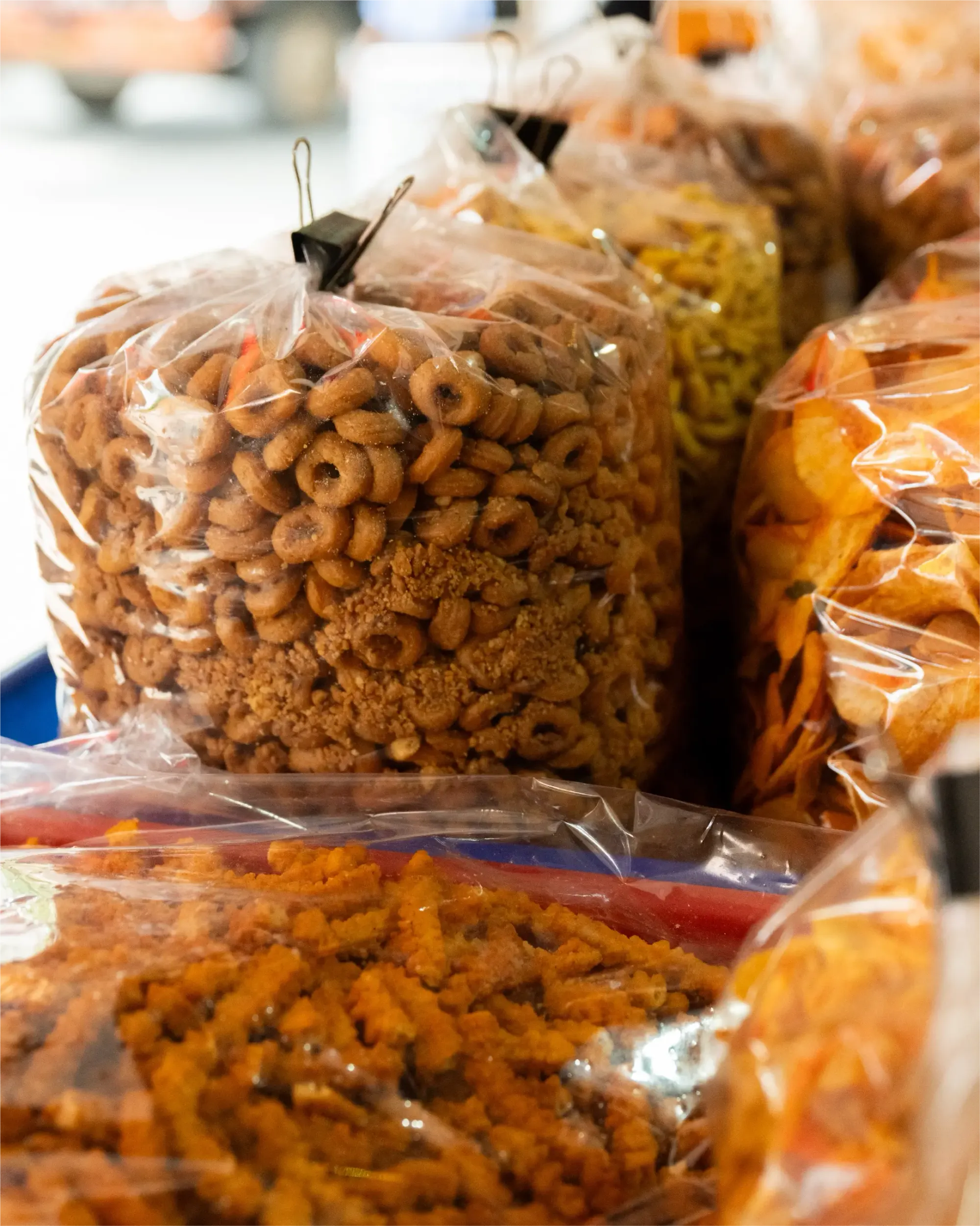 Bags of freshly made savoury snacks displayed at the shop