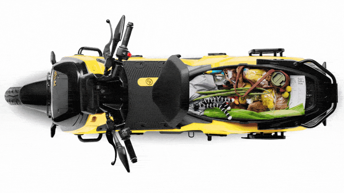GIF: Top-down view of 3 River Indies with open seats, showing underseat storage packed with various items.