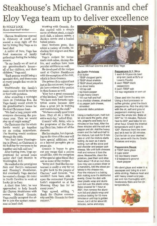 Newspaper clipping featuring Clayton Steakhouse owner Michael Grannis and chef Eloy Vega, with a photo of the two men inside the restaurant and recipes printed alongside the story.