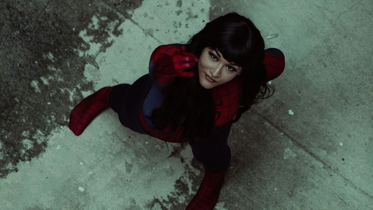 woman in superhero costume looking up