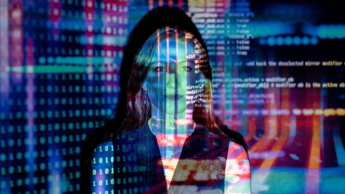 woman in the middle of code projection