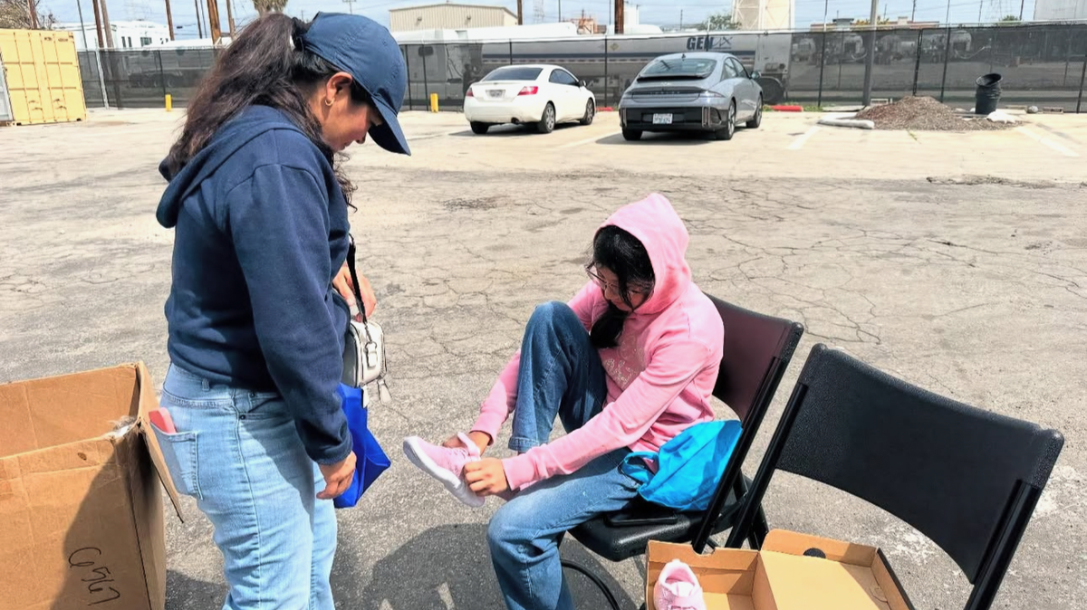 New shoes, big smiles: Maywood councilmember steps up for local kids