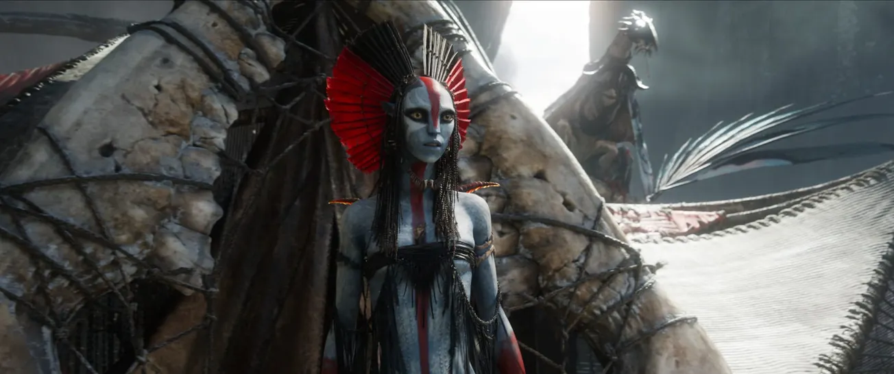 The Na'vi Varang, leader of the Ash Mangkwan clan, standing outside her tent.