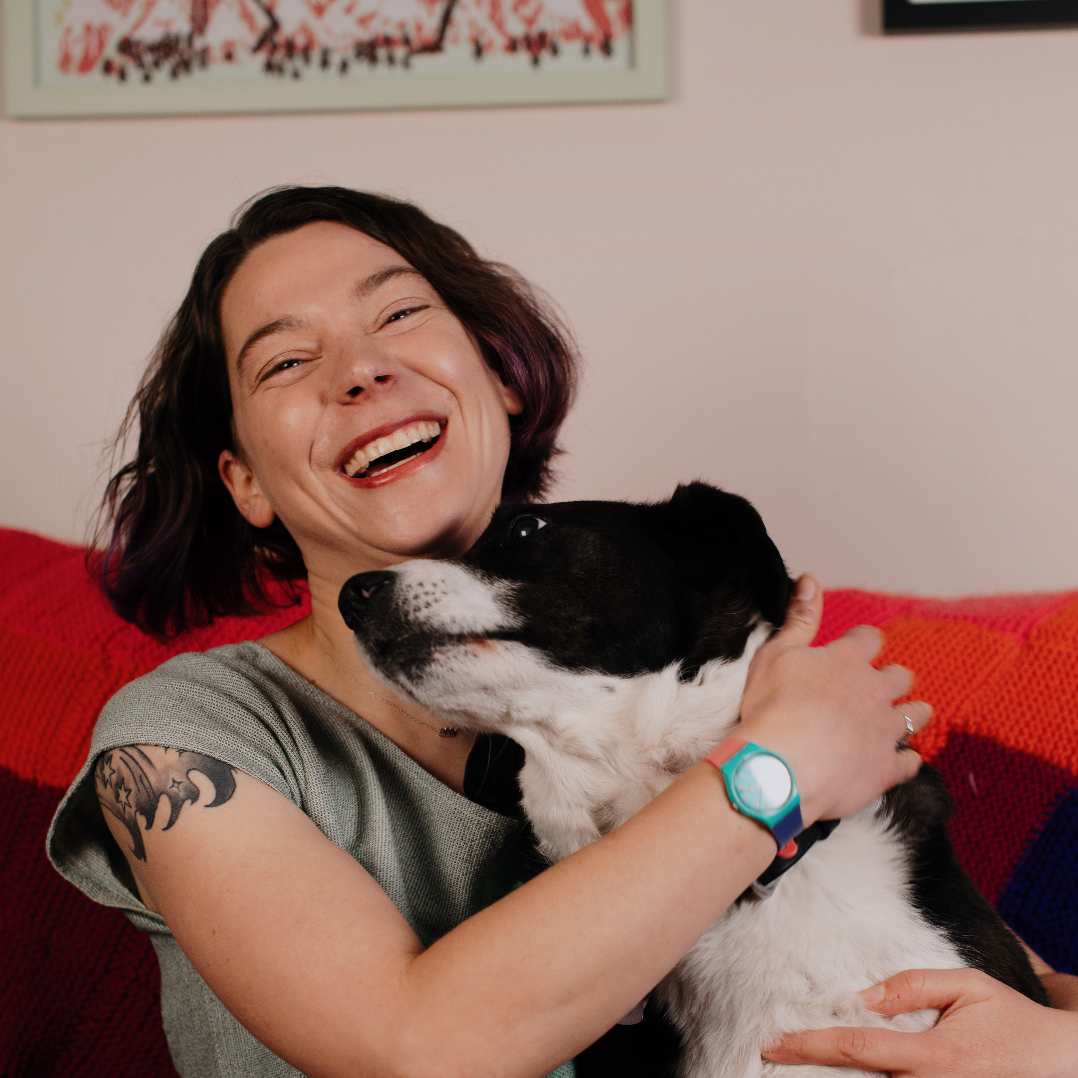 Erin Watson laughing with her dog Basil