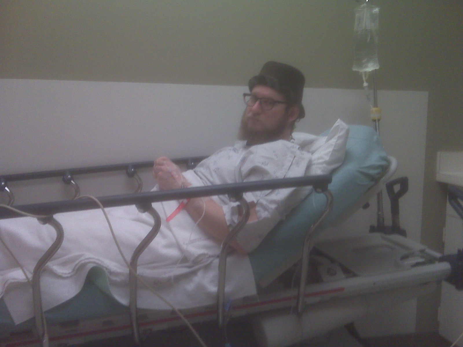 J. Michael Grey in bed