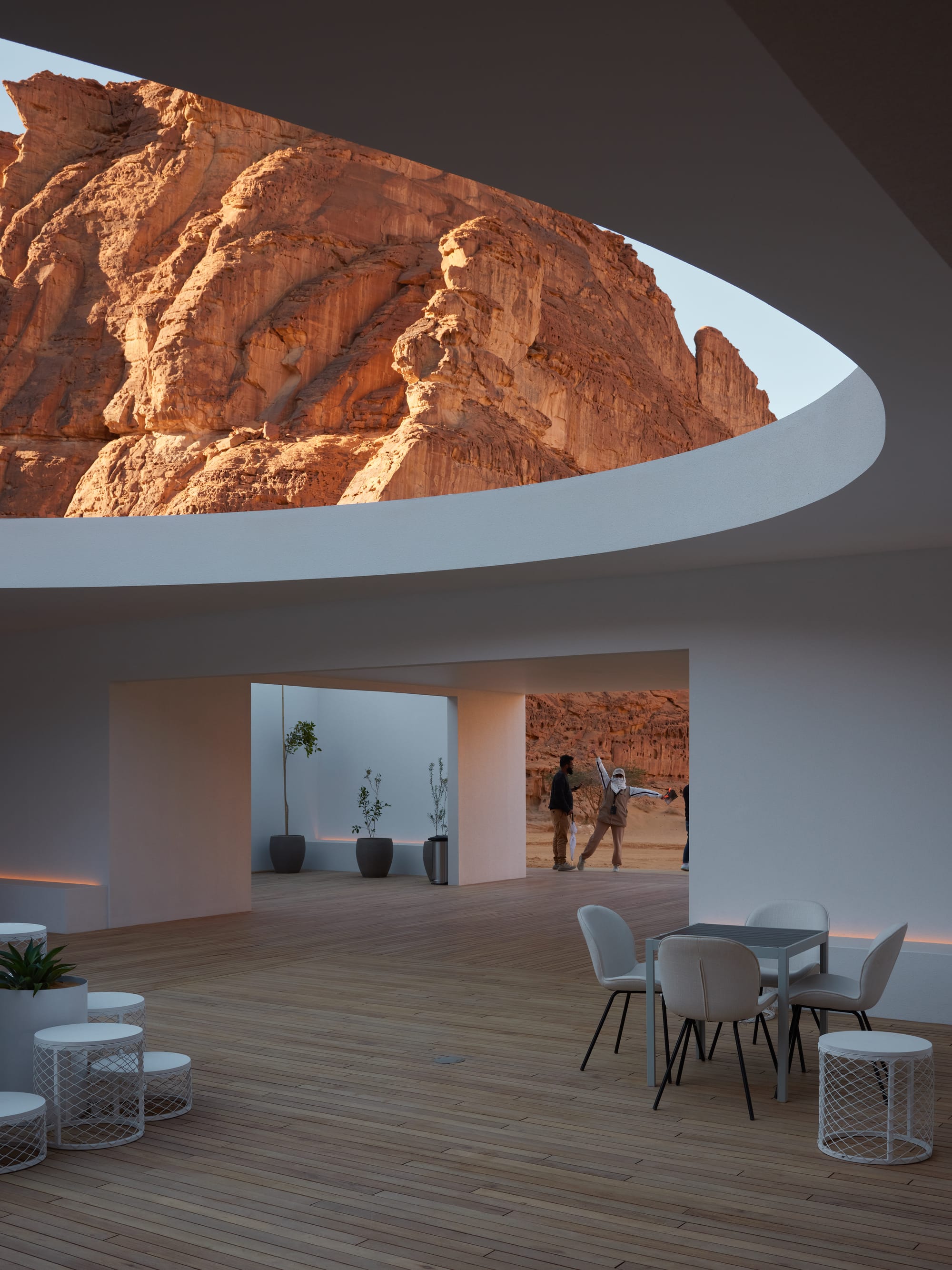 A docent posing for my photo at the 2022 Desert X visitor center in AlUla, Saudi Arabia