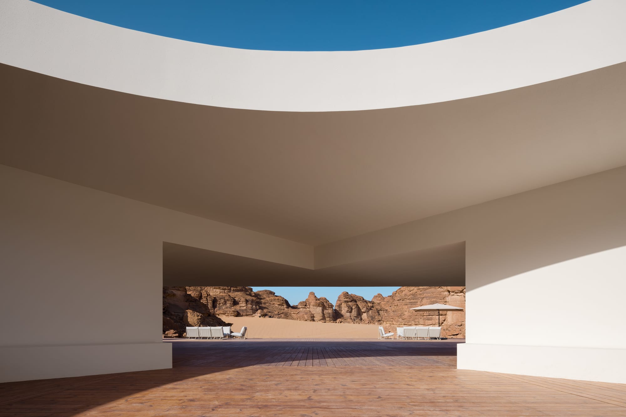 A panoramic view looking out from the Desert X 2024 visitor center in AlUla, Saudi Arabia. Architecture by kwy.studio. 