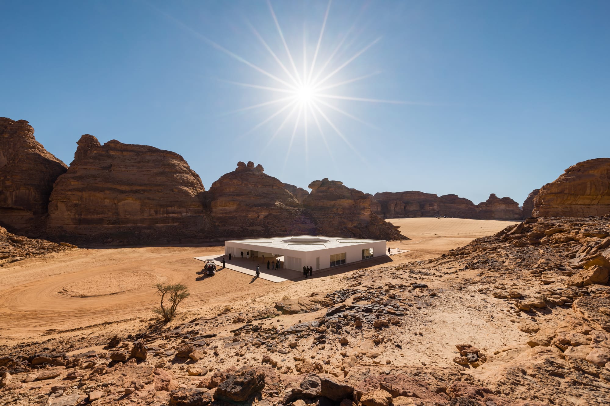 Wide-angle, environmental view of the Desert X 2024 visitor center in AlUla, Saudi Arabia. Architecture by kwy.studio.