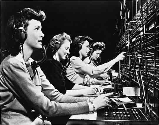 old timey black and white image of white women working as switchboard operators