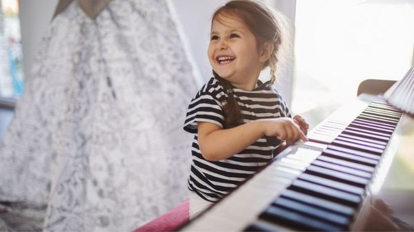 young child and piano