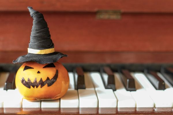 mini pumpkin on piano