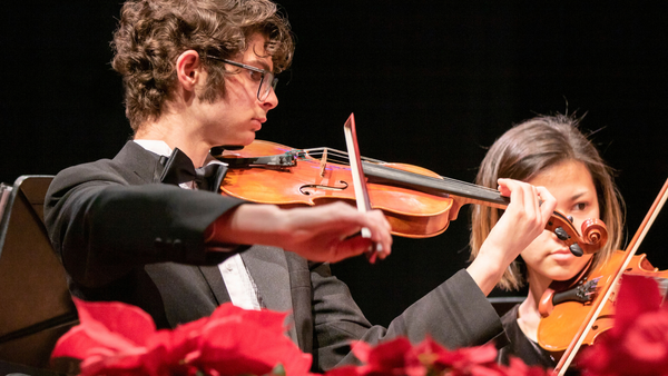 students playing violins; image by Roxanne Minnish