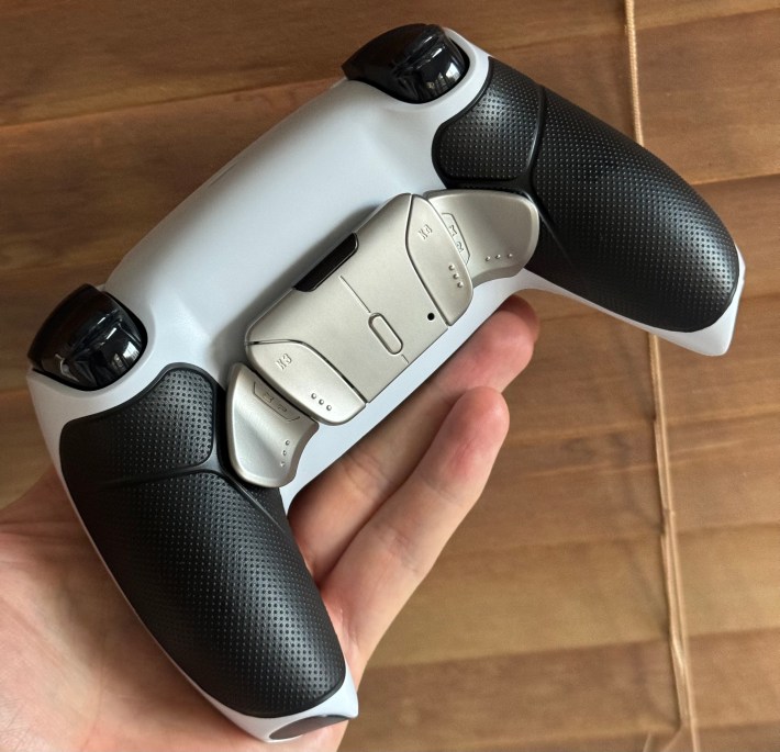 The back of a modded DualSense controller.