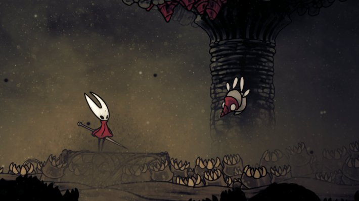 A sand filled environment. Hornet is on the left. A bug with a horned nose floats.