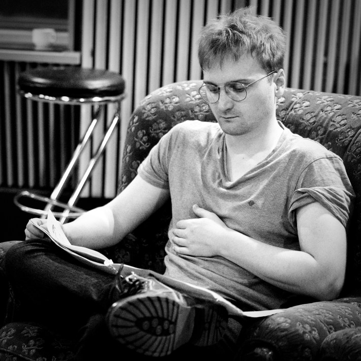 Lorien Testard looking over his music notes for Clair Obscur: Expedition 33. 