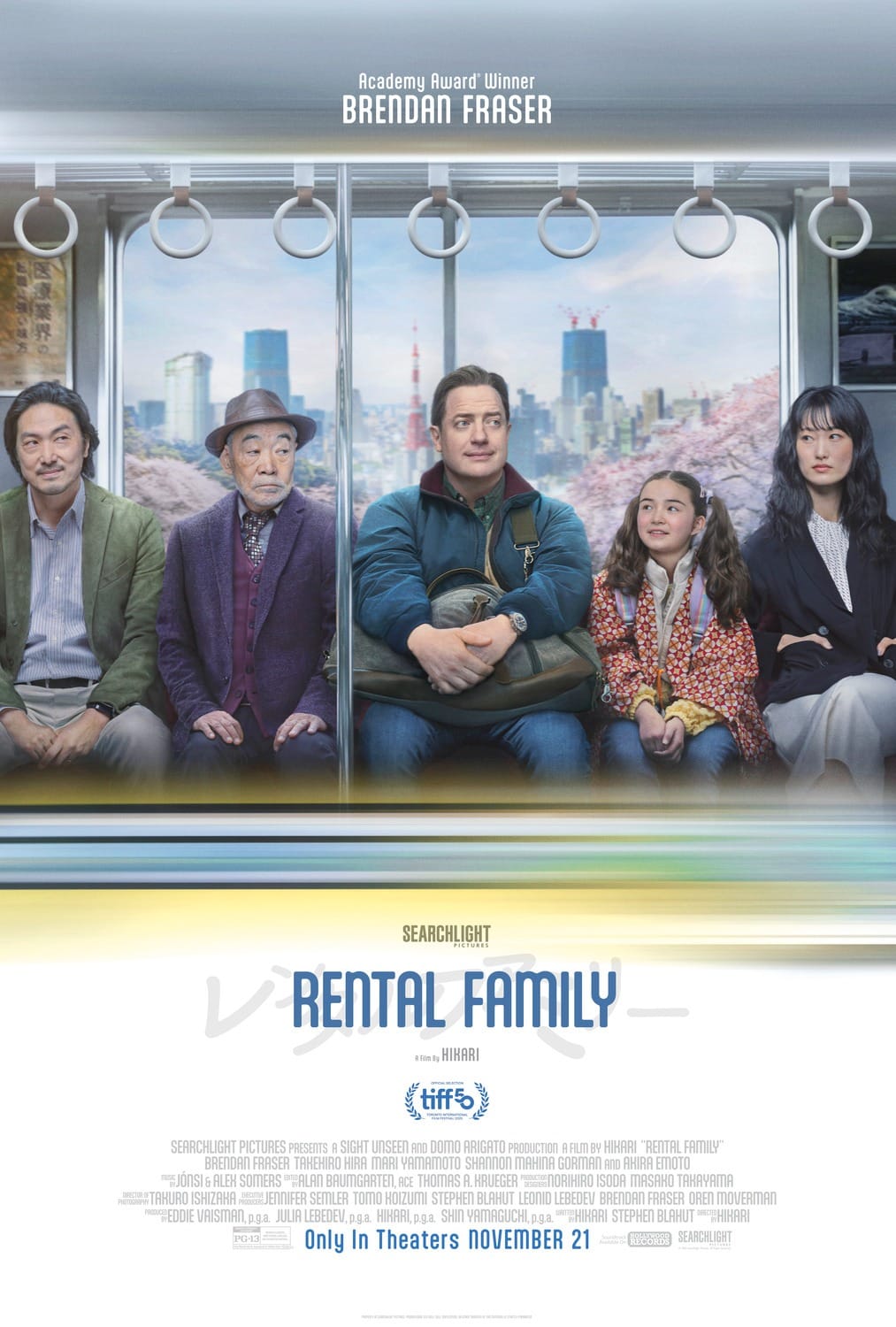 Poster for Rental Family of Brendan Fraser sitting on a train beside his costars. 