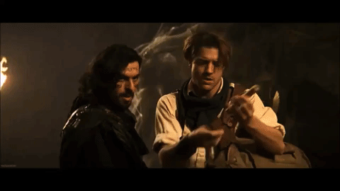 Rick O'Connell lighting a match off Ardeth Bay's cheek. 