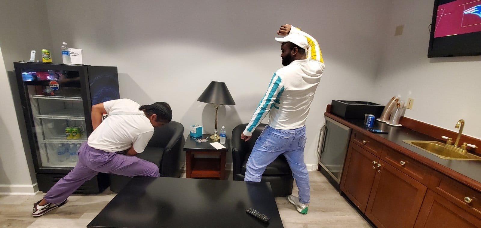 Photo of Ludovic [right] facing off against a friend in a mock fight.