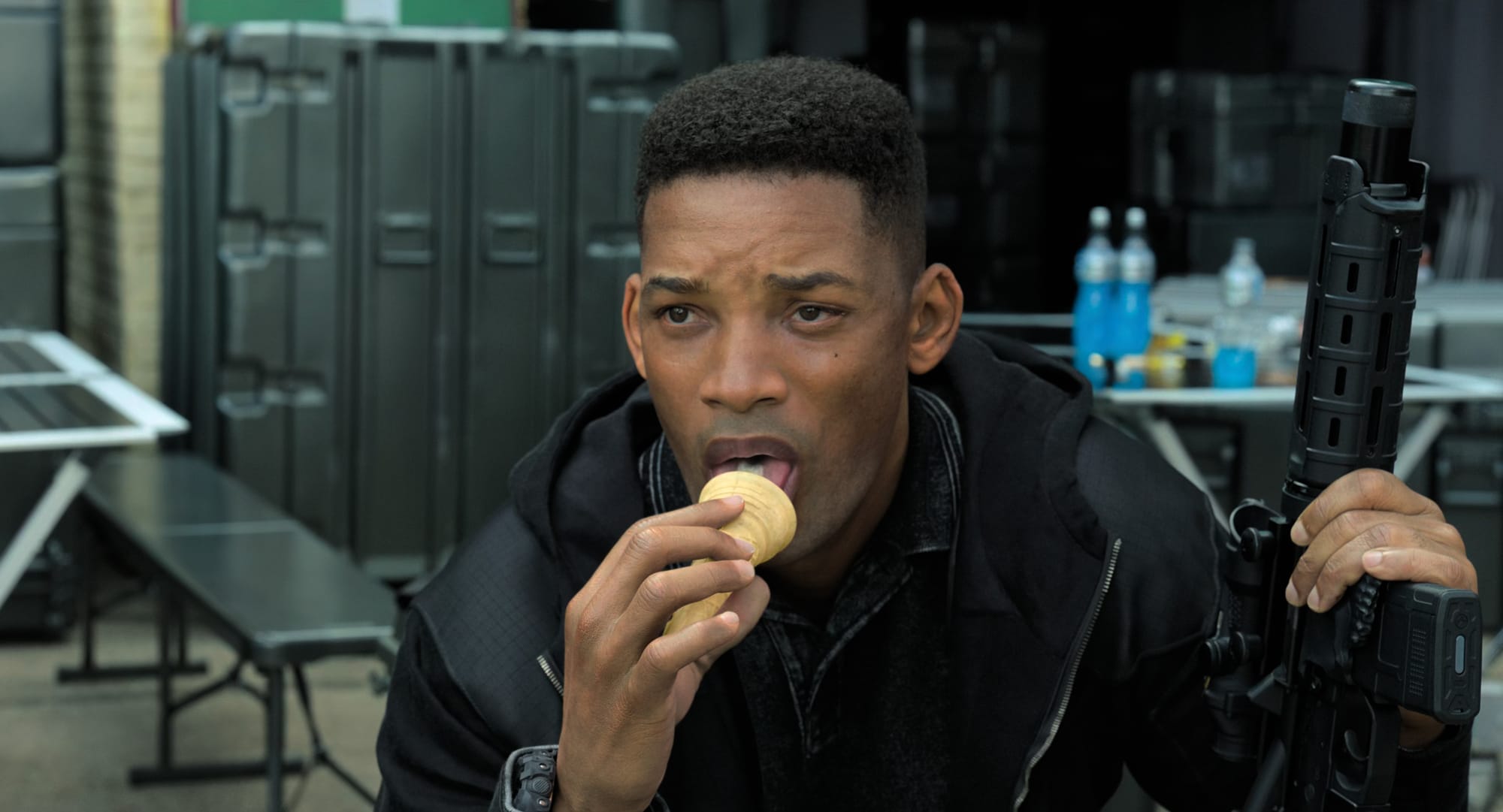 Will Smith digitally deaged in Gemini Man, eating an ice cream with an assault rifle.