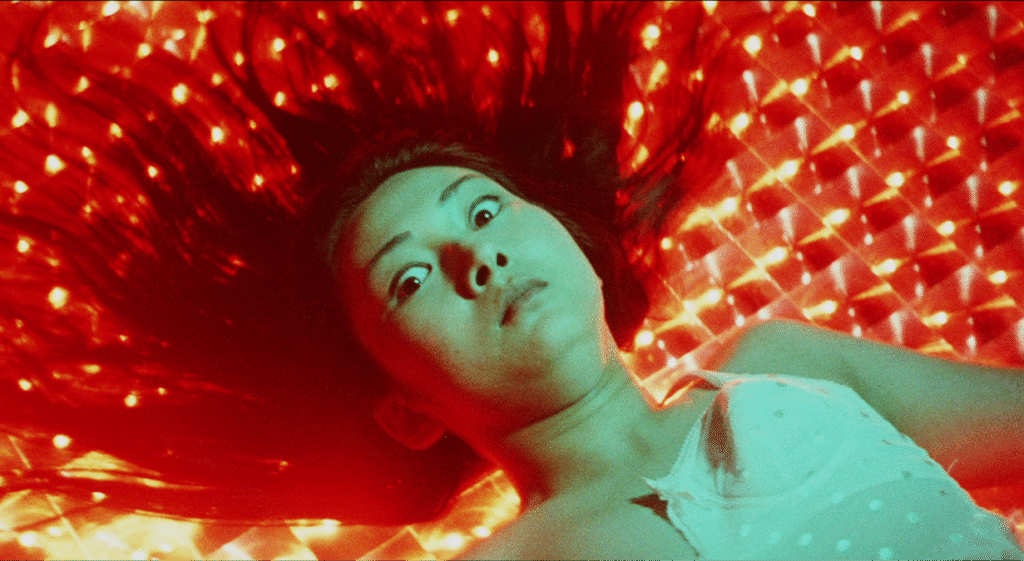 Female Prisoner #701: Scorpion still of Meiko staring into the camera. 