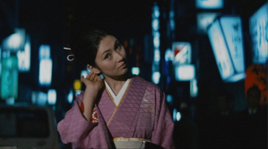 Wandering Ginza Butterfly still of Meiko walking down a city street. 