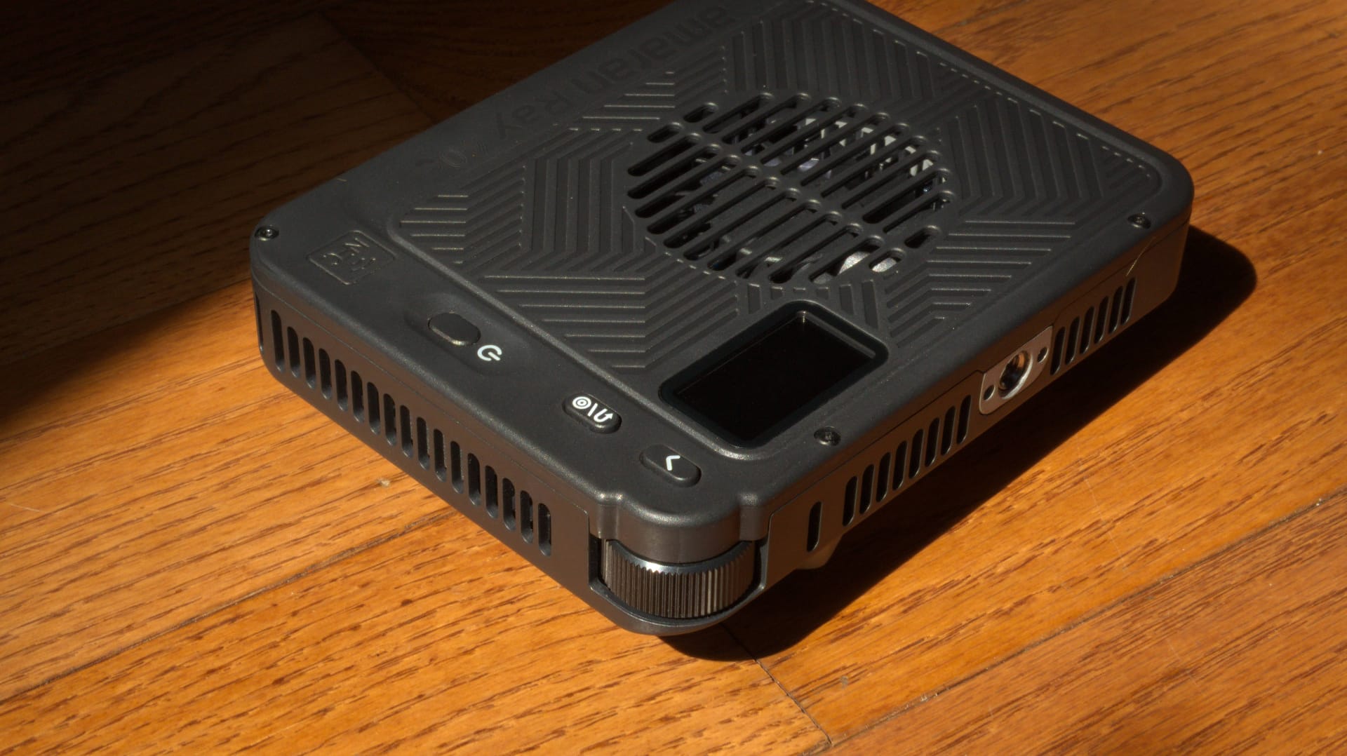 The amaran Ray face down on the ground, a wheel on the bottom, and a fan in the back.