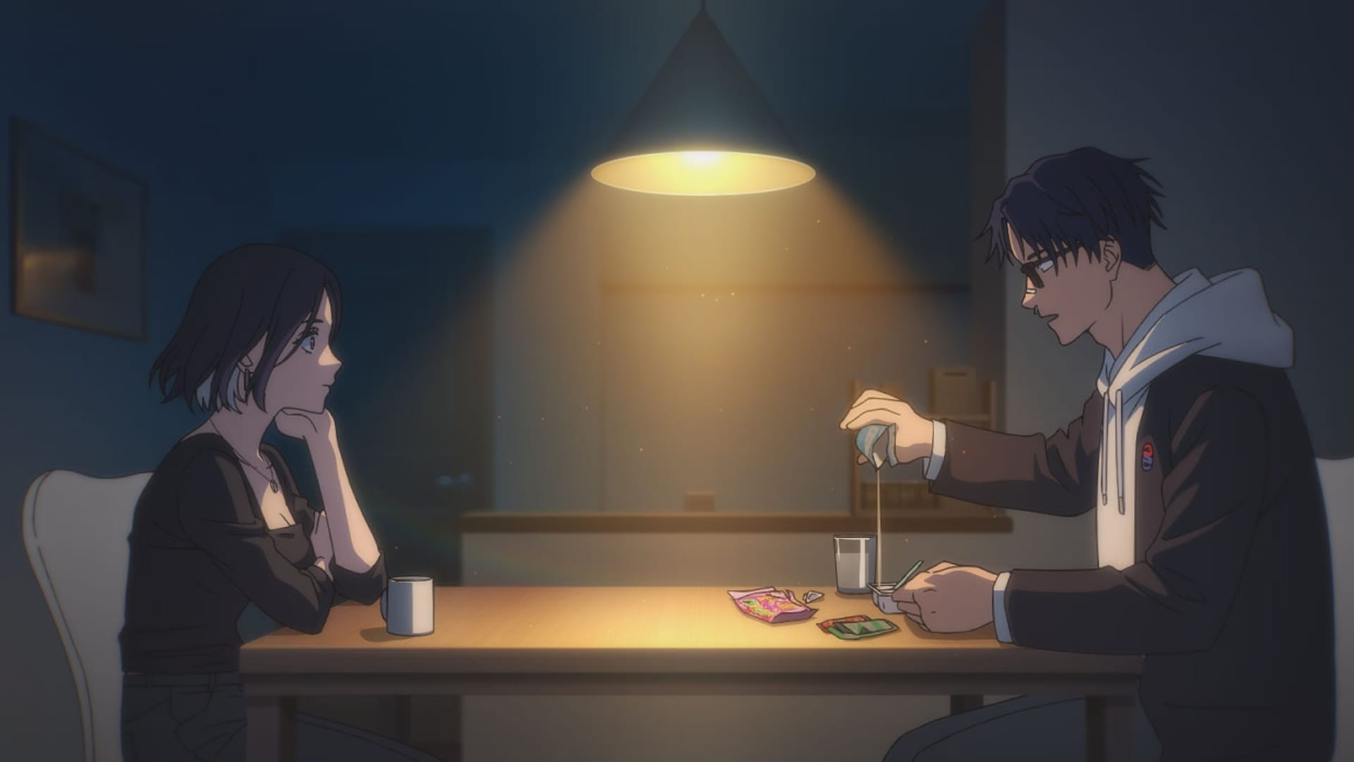 MarriageToxin still of Akari and Gero sitting at a table. 