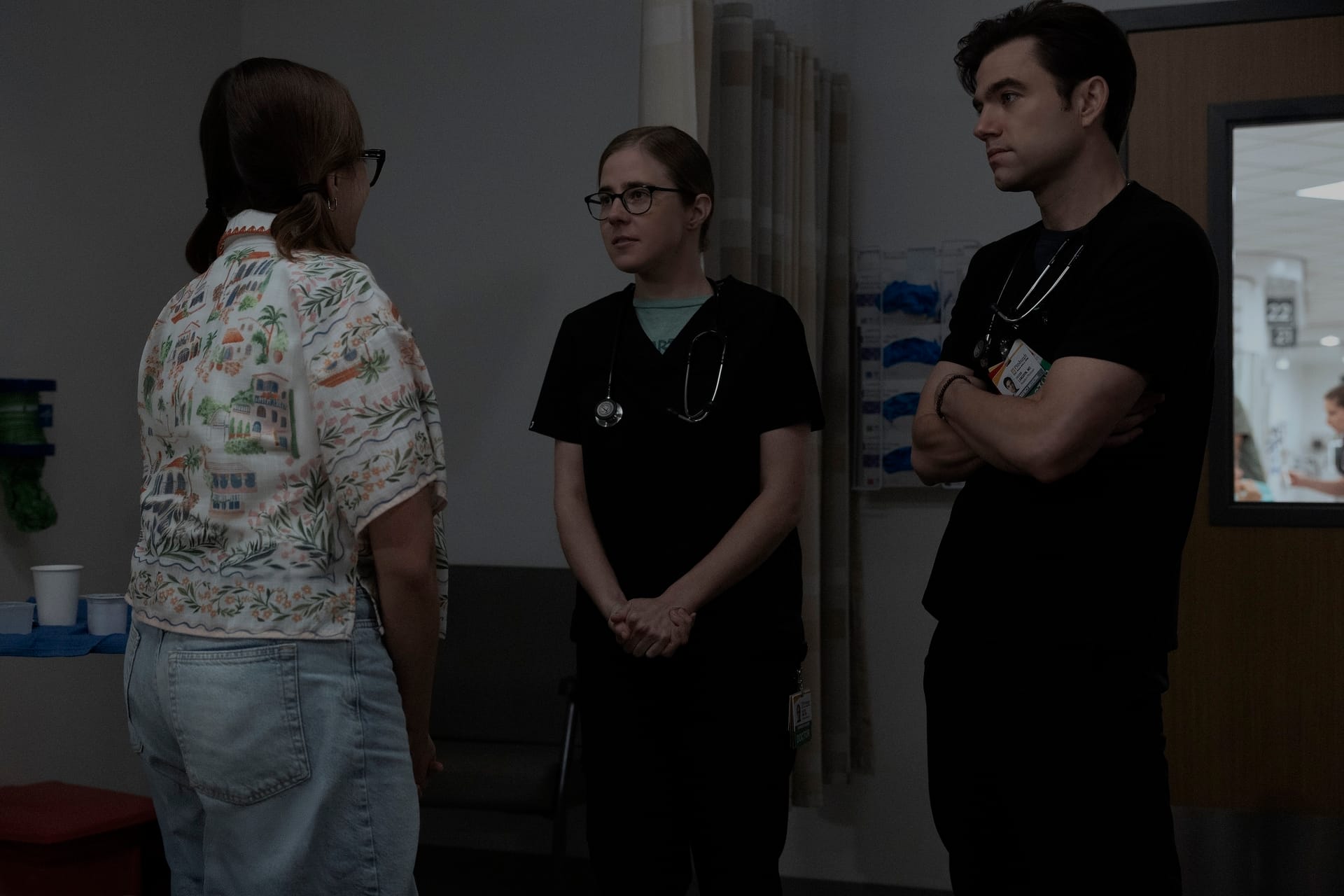 The Pitt still of Becca speaking to Mel and Langdon. 