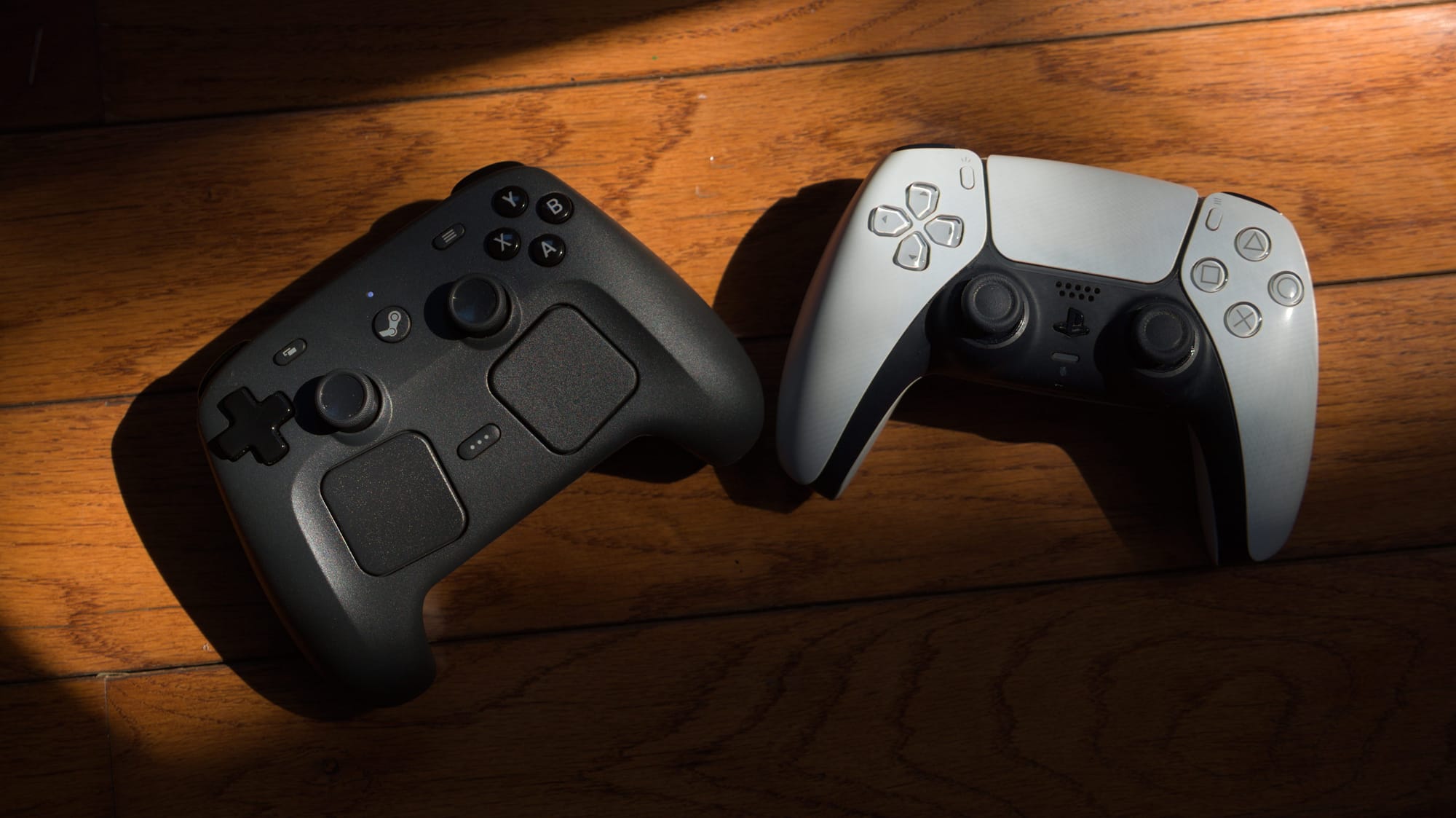 Two controllers are dramatically laid out in sunlight