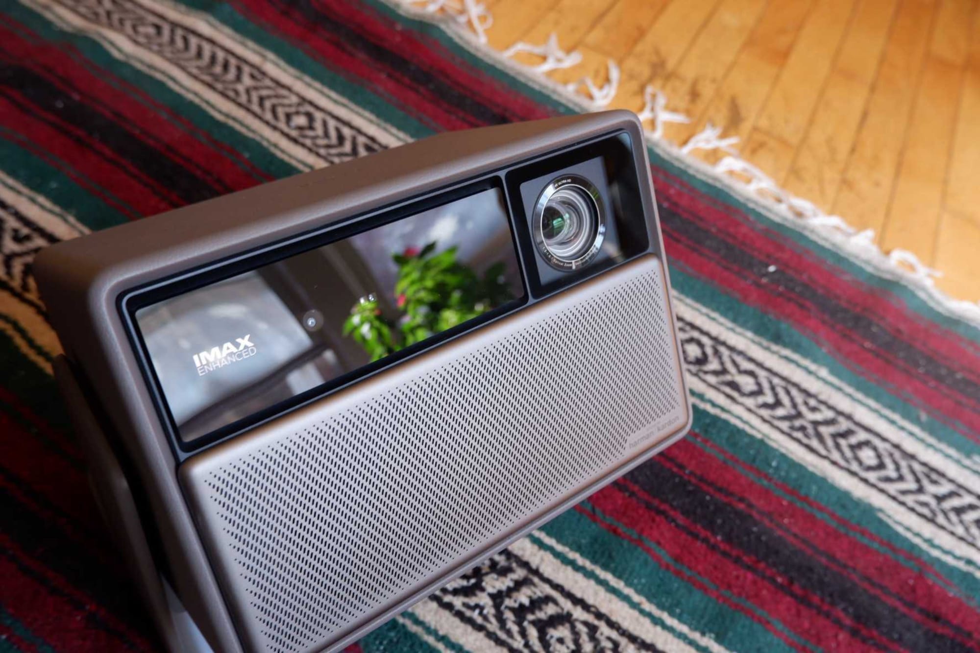 My XGIMI Horizon 20 projector on a throw rug.