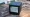 The eInk Inkterface display on a Steam Machine, sitting on a weathered picnic table.
