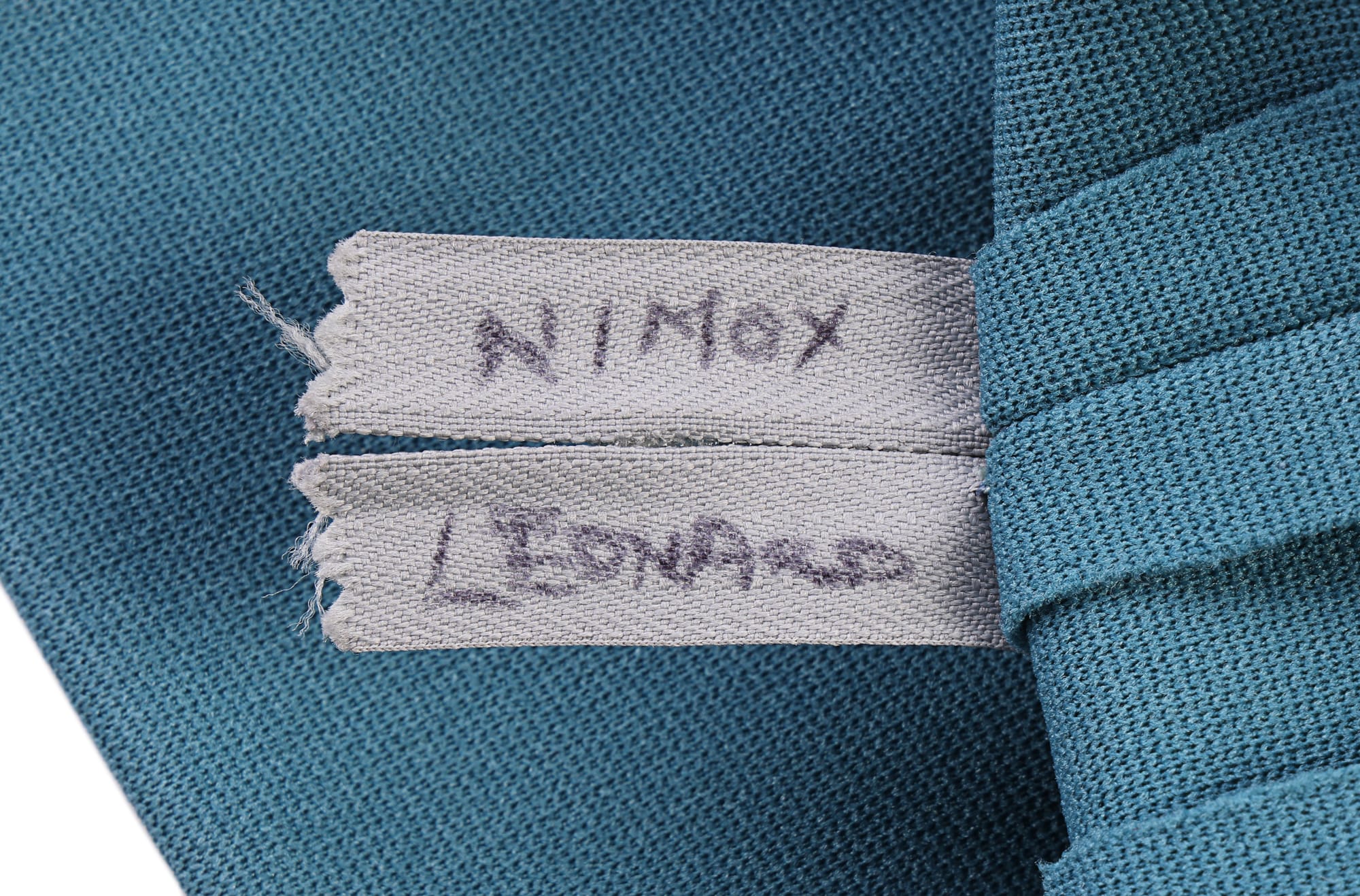 And the tunic's inside label, written in Sharpie, identifying it's meant for "Nimoy, Leonard." 