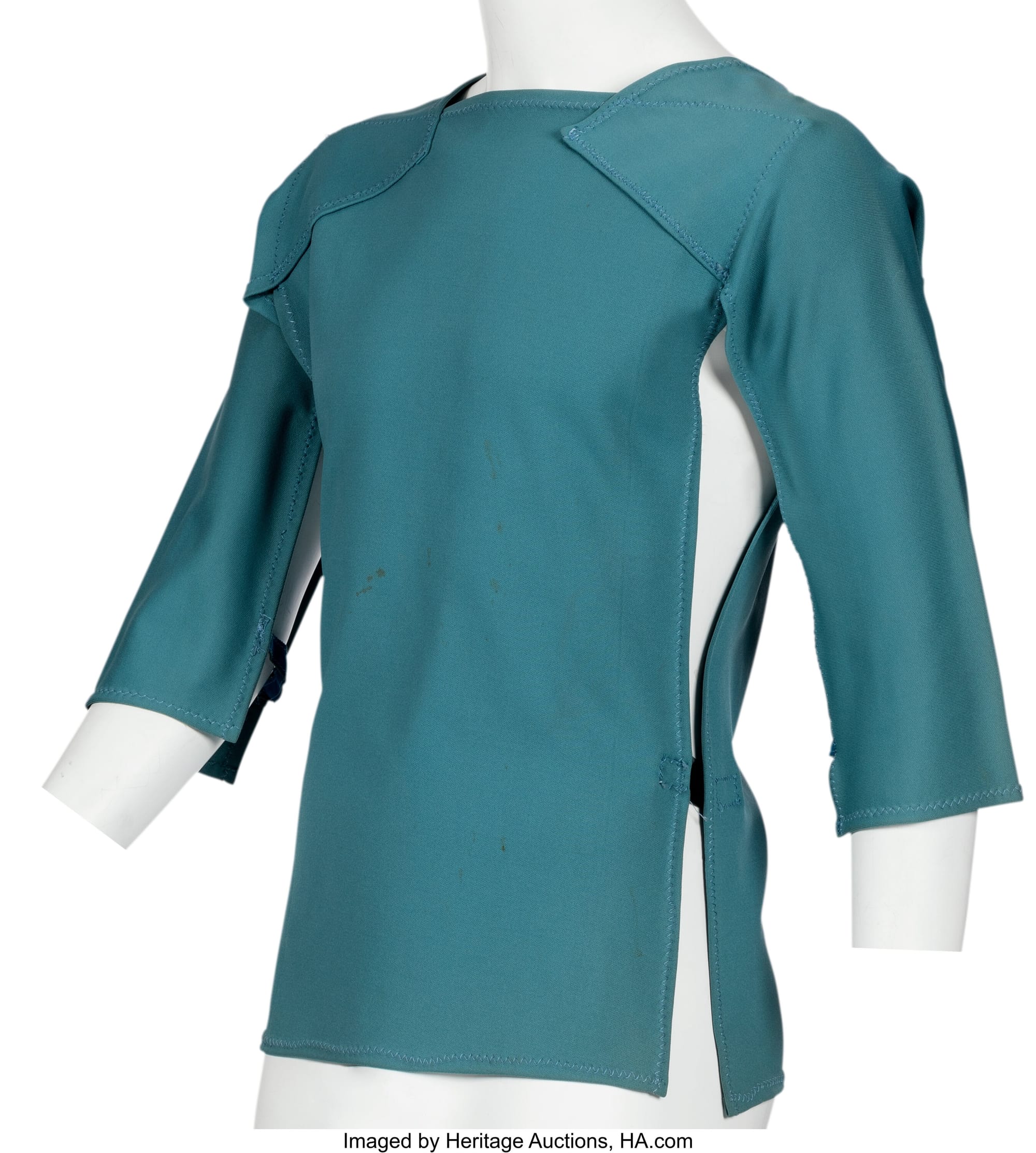 An unused medical smock from the aborted STAR TREK II. It's blue with opening slits at the sides and elbow length sleeves. 