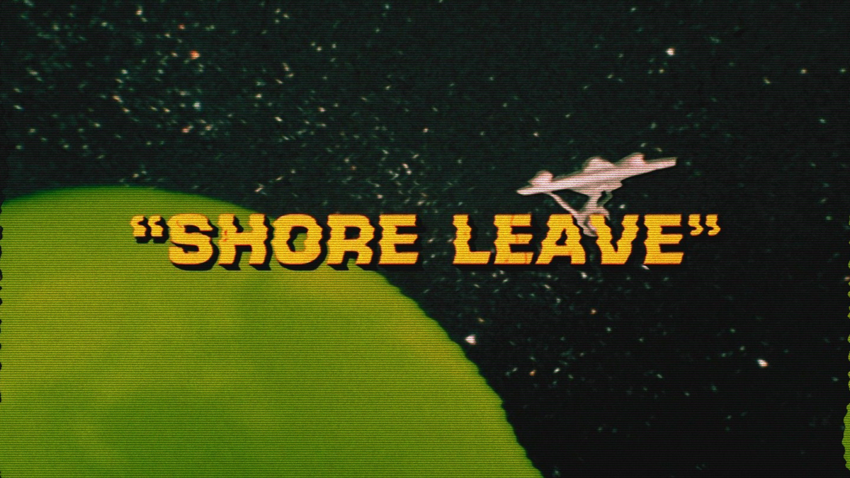 Fuzzy TV image of the title card from the STAR TREK episode “Shore Leave” with the Enterprise in orbit of a green planet.