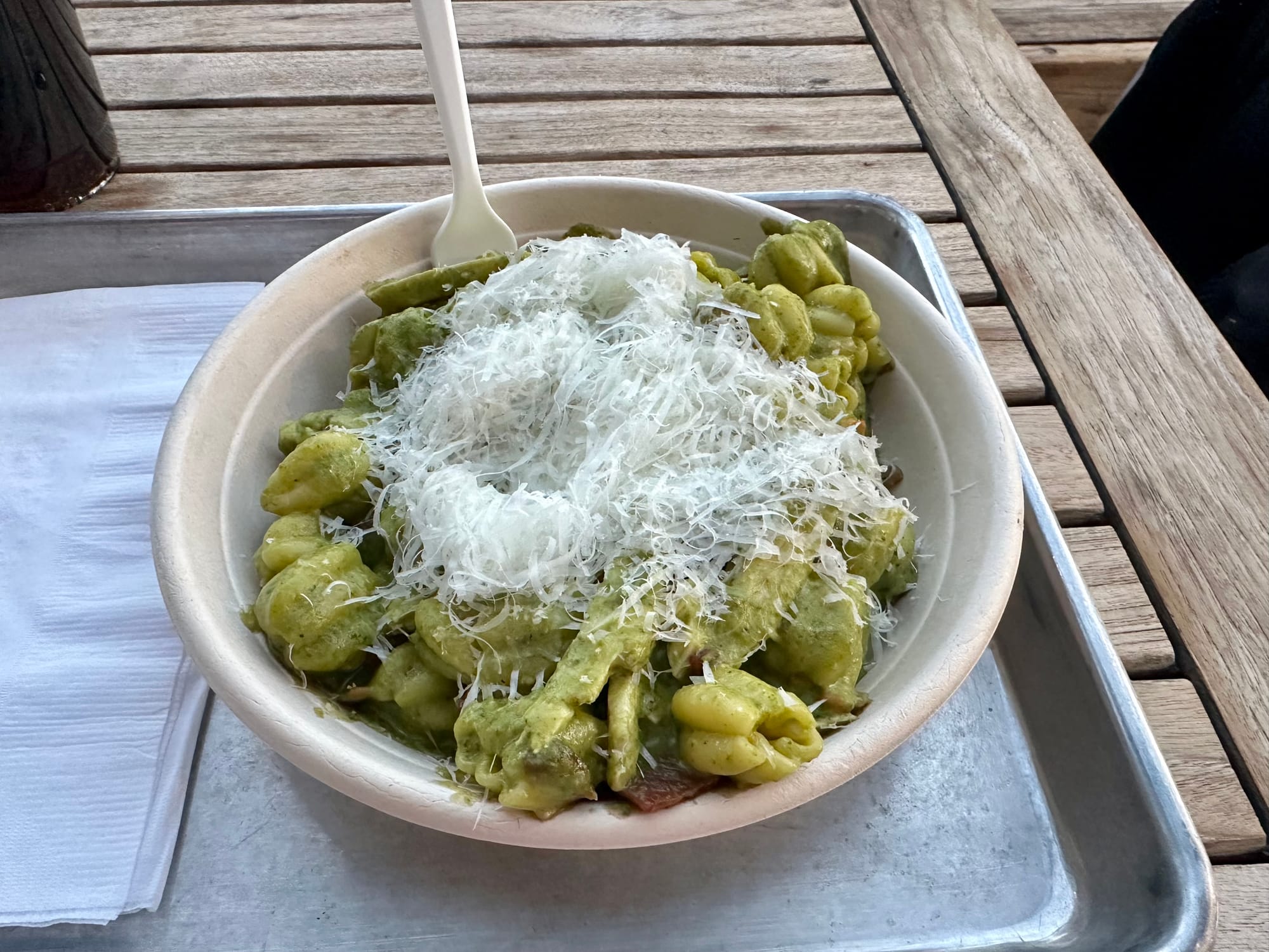 A photo of my dinner, pesto pasta with chicken, topped with cheese