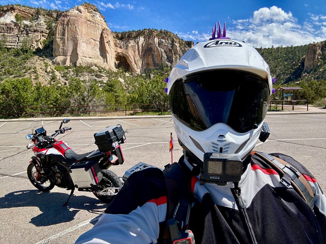 A selfie of myself in front of my motorcycle in front of the El Malpais National Conservation Area