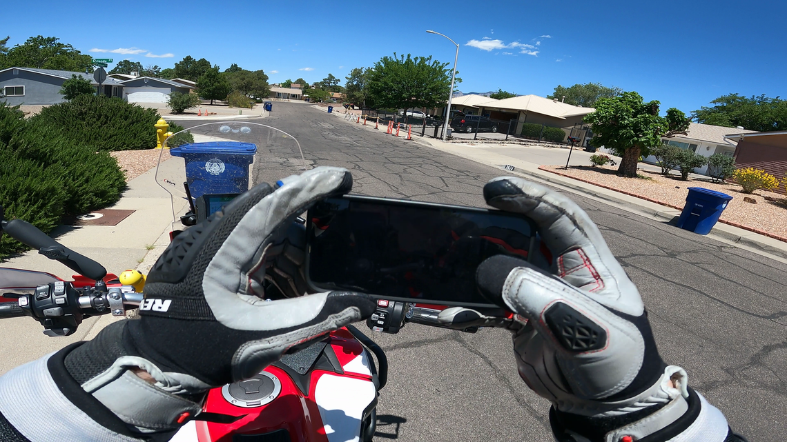 A snapshot from my GoPro of me taking a picture of the Walter White house with my iPhone