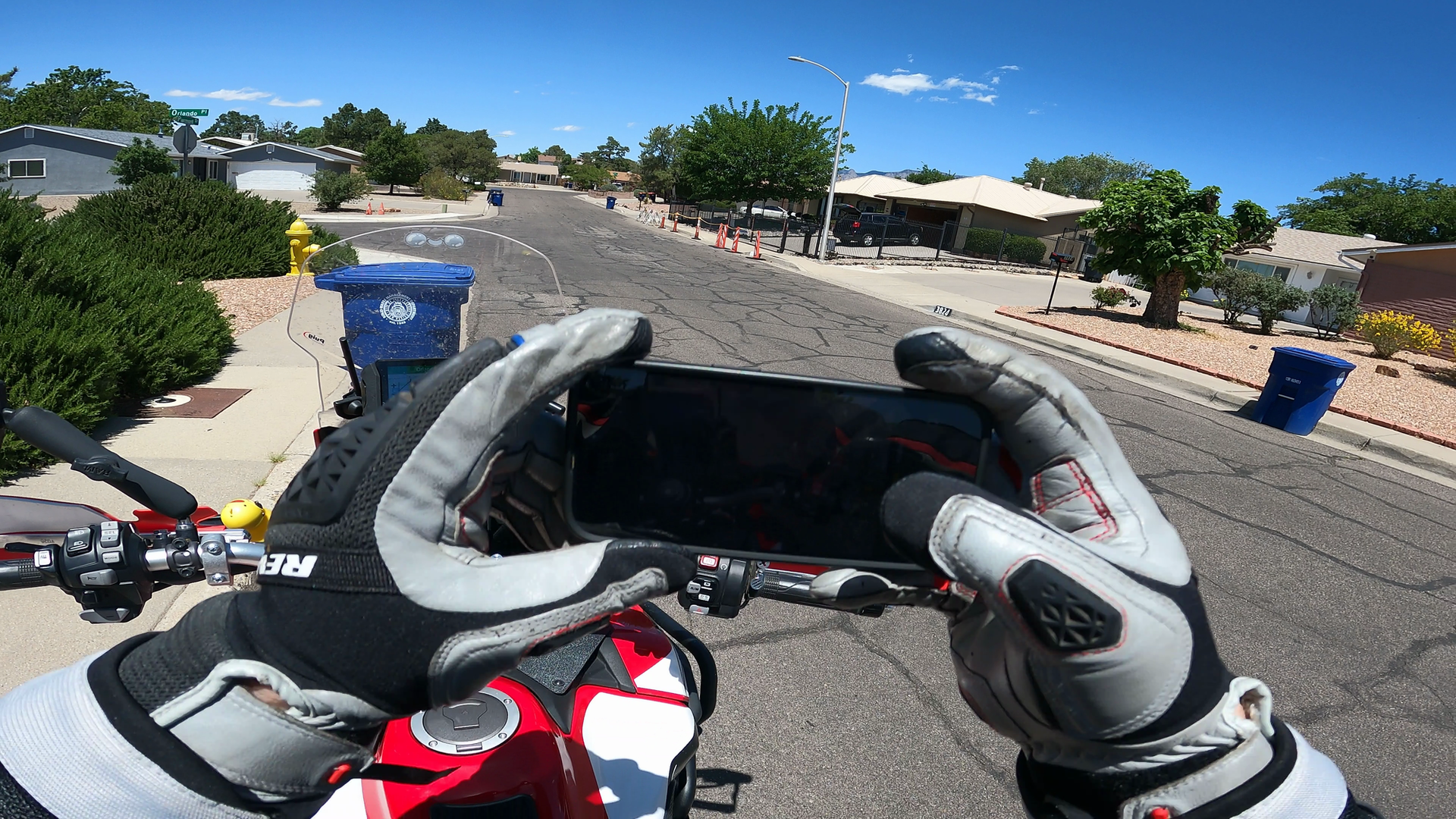A snapshot from my GoPro of me taking a picture of the Walter White house with my iPhone